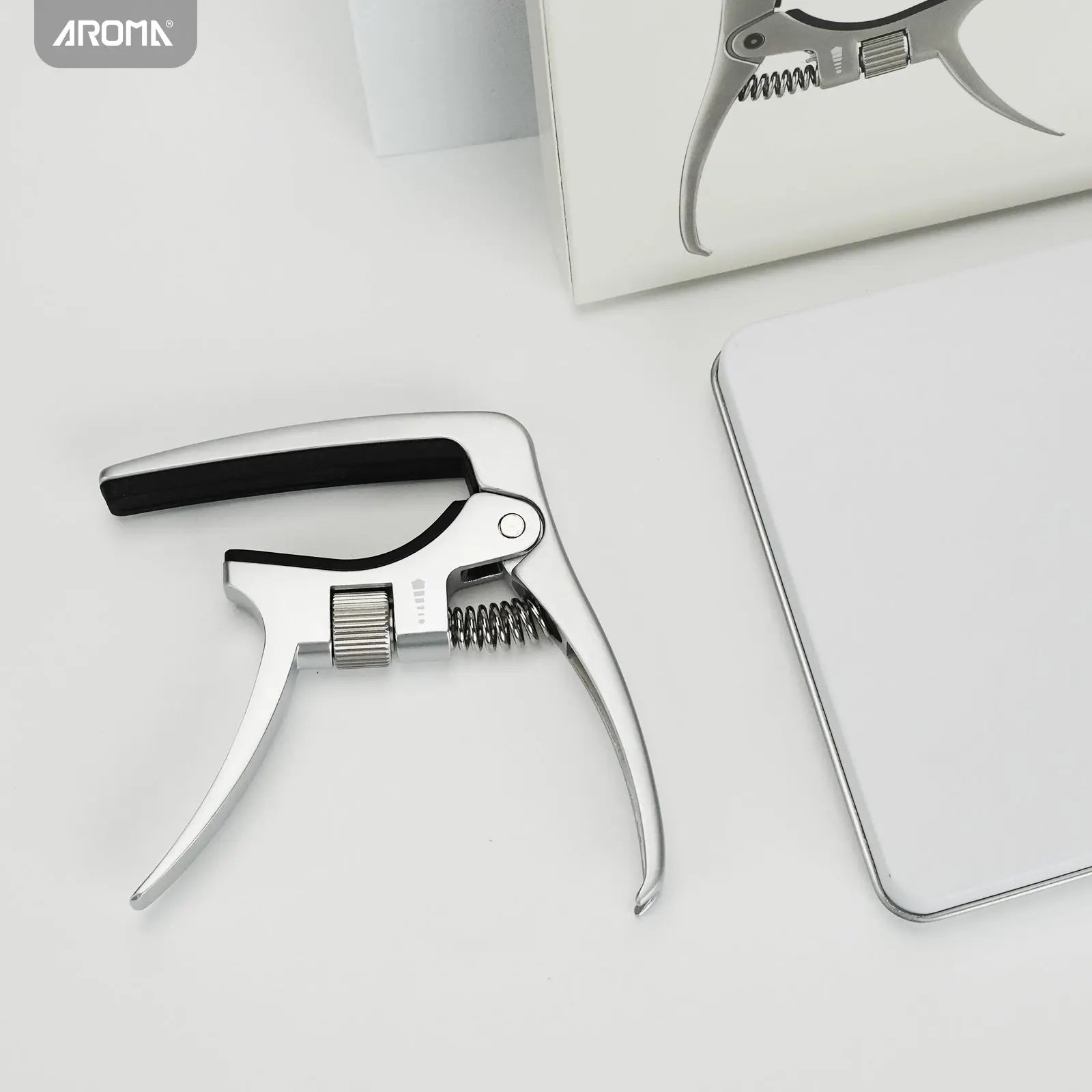 Beginner-s-Guide-to-Guitar-How-to-Use-an-Aroma-Capo Aroma Music